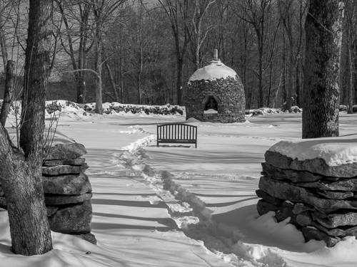 black and white, stupa and bench in snow, seen from Dharma Hall, track pathway in snow